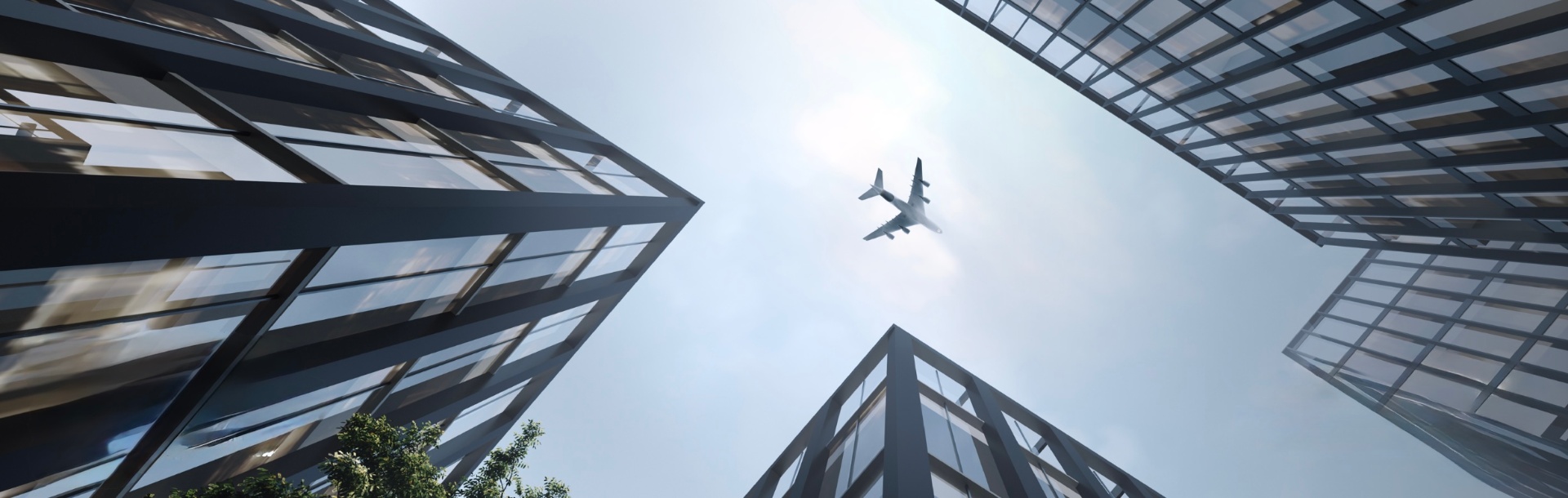 Modern skyscrapers with airplane flying overhead
